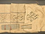 a piece of cloth with a design on it and a pair of scissors