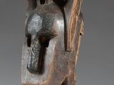 an image of a sculpture of a bird head on a stand