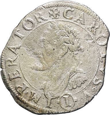 a silver coin with an image of a woman on it