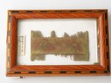 an image of a picture of a piece of art in a wooden frame