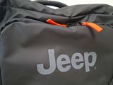 the jeep logo is on the side of a duffel bag