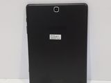 a close up of a black tablet with a sticker on it