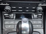 a close up of a car ' s dashboard with a steering control