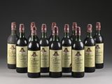 six bottles of wine are lined up in a row on a table