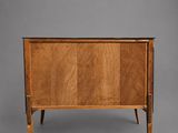 a wooden chest with two drawers and a door on one side