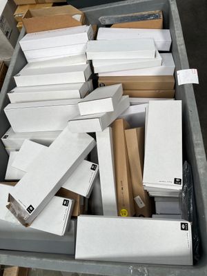 a bin full of boxes of white and brown paper