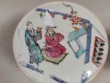 a plate with a picture of a man and a woman on it