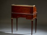 an antique wooden desk with a marble top and legs