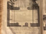 an old book with a drawing of a building inside of it