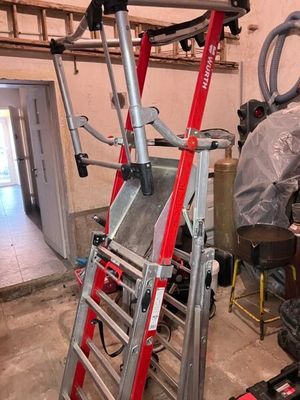 an image of a ladder in a garage that is being worked on