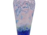 a blue and white vase with a pink and blue design on it