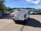 a white van that is parked in a parking lot