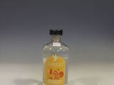 a small bottle of alcohol sitting on a table