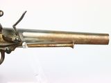 an old gun that is on display in a museum