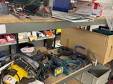 many tools on the shelves in the garage