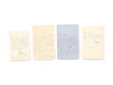 three old papers are lined up in a row on a white surface