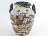 a vase with a picture of a man and a woman riding a horse