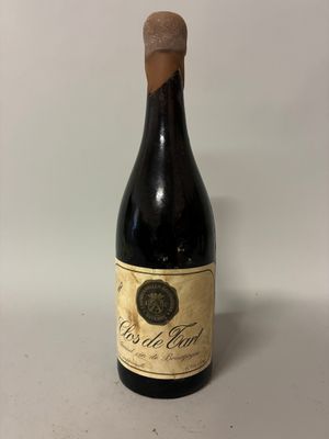 a bottle of wine that is sitting on a table