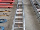a ladder that is sitting on the ground next to other equipment