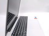 two laptops sitting side by side on a white surface