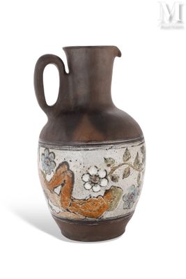 a vase with a bird on it sitting on a table
