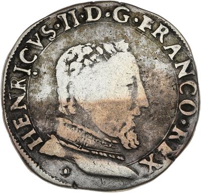 une pièce d'argent portant l'image d'un homme
