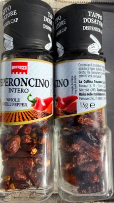 two jars of pepperonio next to each other on a counter