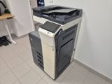 a black and white printer sitting on top of a desk