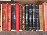 many old books in a box on the floor