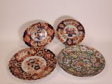 three chinese bowls and a bowl with floral designs on them