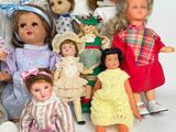 a lot of dolls that are sitting together on a table