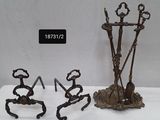 three metal sculptures that are sitting on a table