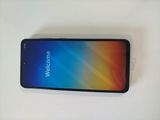 the back of a black phone with a welcome sign on the screen