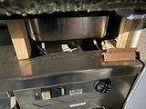 an image of a machine with a bowl on it
