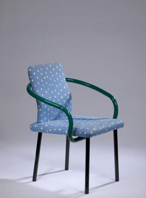 a blue chair with a polka dot pattern on it