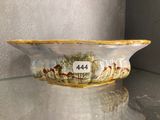 a bowl that has a picture of horses on it