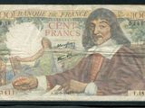 un ancien billet de banque sur lequel figure l'image d'un homme tenant un éventail