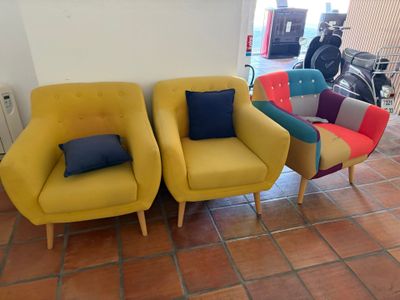 three chairs that are sitting next to each other in a room