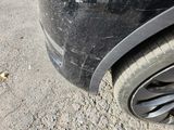 a close up of a car tire on the road