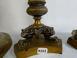 a bronze statue of a lion on a pedestal