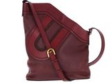 a close up of a red purse on a white background