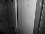 a door to a bathroom with a toilet in it