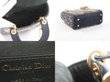 an image of a black purse with a gold handle
