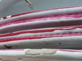 a stack of surfboards stacked on top of each other