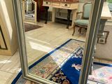 a mirror that is sitting on the floor in the room