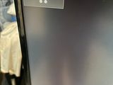 a computer monitor that has a price tag on it