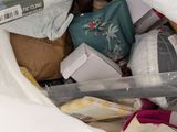 a pile of items in a plastic bag on the floor