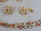 a necklace and earring set on a table