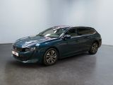 the blue car is parked in a large room with a black floor
