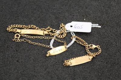 a close up of a gold chain with a tag on it